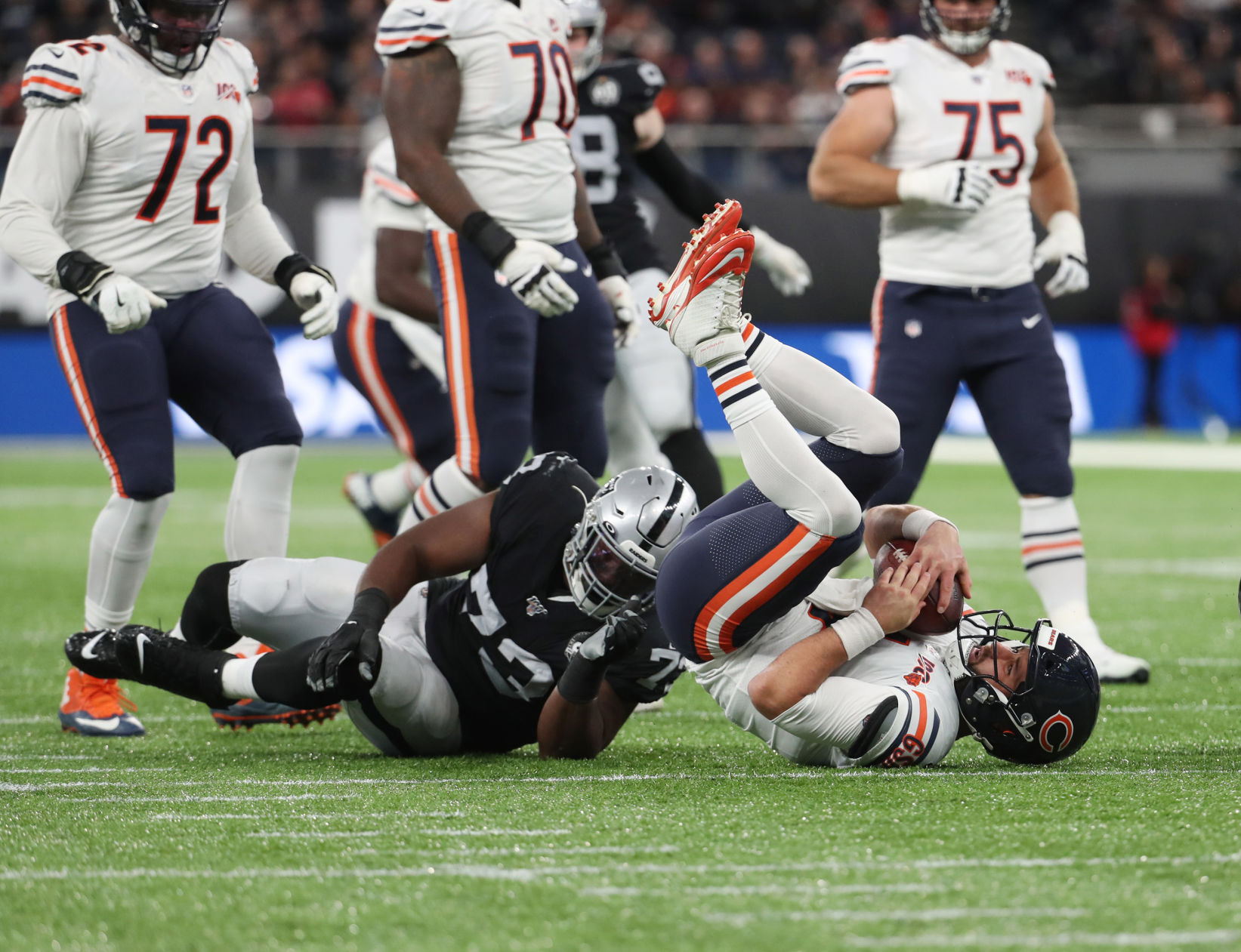 Chicago Bears quarterback Chase Daniel (4) is sacked by Oakland Raiders defensive tackle Maurice Hurst (73) in the second quarter Sunday, Oct. 6, 2019 at Tottenham Hotspur Stadium in London, UK.